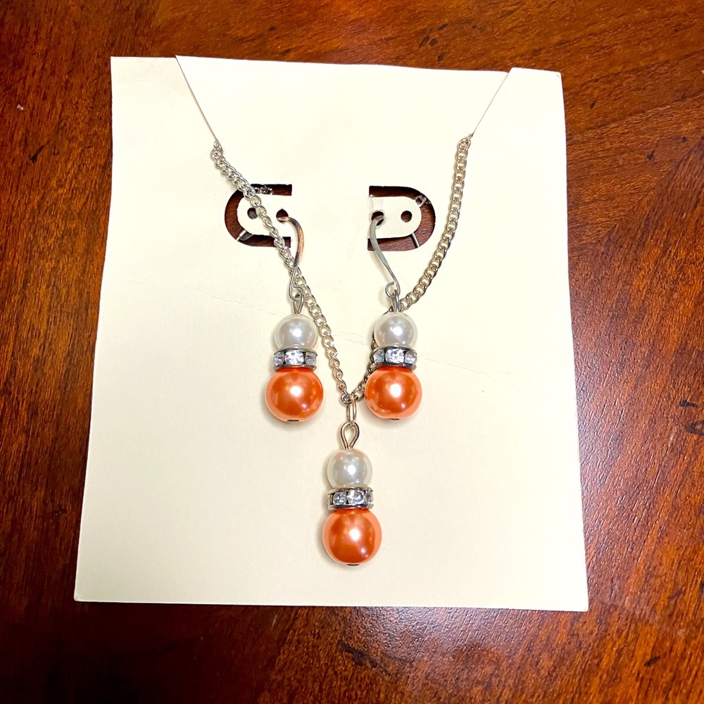 Like new, handmade bedazzling manmade white/coral pearl necklace & earrings set